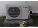 HVAC unit on a concrete pad, surrounded by greenery at 21456 Holdern Ave, Port Charlotte, FL 33952