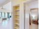 Hallway view showcasing spacious layout and access to bedroom and living area at 21456 Holdern Ave, Port Charlotte, FL 33952