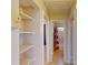 Hallway featuring built-in shelving, doors leading to other rooms, and tiled flooring at 21456 Holdern Ave, Port Charlotte, FL 33952