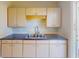 Functional kitchen with a double basin sink, and neutral countertops at 21456 Holdern Ave, Port Charlotte, FL 33952