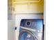 Laundry featuring modern front load washing machine in storage cubby at 21456 Holdern Ave, Port Charlotte, FL 33952