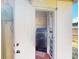 A laundry room features a new washing machine and shelving space for convenient storage solutions at 21456 Holdern Ave, Port Charlotte, FL 33952
