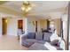 Comfortable living room with a plush sectional sofa, and open layout connecting the living space with the kitchen at 21456 Holdern Ave, Port Charlotte, FL 33952