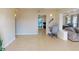 Spacious living room featuring tile floors, an open layout, and natural light at 21456 Holdern Ave, Port Charlotte, FL 33952
