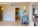 Open living room featuring neutral tile flooring and an adjacent kitchen area at 21456 Holdern Ave, Port Charlotte, FL 33952