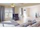 Bright living room showcasing tile floors, recessed lighting, and large windows for ample natural light at 21456 Holdern Ave, Port Charlotte, FL 33952