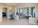 Open-concept living space seamlessly integrates the living room, dining area, and kitchen for modern living at 21456 Holdern Ave, Port Charlotte, FL 33952
