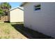 The backyard features an updated shed and well-maintained green space at 21456 Holdern Ave, Port Charlotte, FL 33952