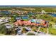Panoramic aerial view showcasing the community's amenities, including pools and tennis courts at 2478 Brassica Dr, North Port, FL 34289