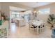 Spacious kitchen with stainless steel appliances, a central island, a breakfast bar, and an adjacent dining area at 2478 Brassica Dr, North Port, FL 34289