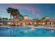 Stunning pool with lounge chairs and palm trees at the clubhouse for a relaxing resort-style atmosphere at 2478 Brassica Dr, North Port, FL 34289