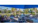 Inviting poolside dining area with ample seating for residents to enjoy meals and socialize at 2478 Brassica Dr, North Port, FL 34289