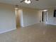 Spacious living area with tile flooring, neutral paint, and a large closet at 26461 Explorer Rd # B, Punta Gorda, FL 33983