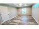 Inviting bedroom with wood-look floors and large windows at 342 Sweetwater Dr, Rotonda West, FL 33947
