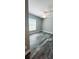 Bright bedroom featuring wood-look tile floors, a ceiling fan, and a window providing natural light at 342 Sweetwater Dr, Rotonda West, FL 33947