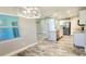 Bright kitchen featuring stainless appliances, granite countertops, and wood-look tile flooring at 342 Sweetwater Dr, Rotonda West, FL 33947