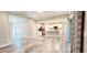 Open-concept living room and kitchen area with sliding glass doors and tile flooring at 342 Sweetwater Dr, Rotonda West, FL 33947