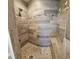 Custom tiled walk-in shower with a built-in bench at 342 Sweetwater Dr, Rotonda West, FL 33947