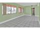 Sunlit living room with tiled floors, enhanced by the natural light from the oversized window at 520 Sharon Cir, Port Charlotte, FL 33952