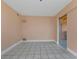 Simple room with tile flooring, a sliding glass door, and neutral paint at 520 Sharon Cir, Port Charlotte, FL 33952