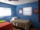 Comfortable bedroom featuring natural light, twin beds, and closet at 5233 Palena Blvd, North Port, FL 34287