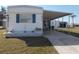 Charming single-story home featuring a covered parking area and well-maintained landscaping at 5233 Palena Blvd, North Port, FL 34287