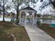 Lakeside gazebo provides a serene spot to relax and enjoy tranquil water views with seating and a charming design at 5233 Palena Blvd, North Port, FL 34287