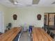 Community recreation room featuring long tables, folding chairs, and dart boards for resident activities and socializing at 5233 Palena Blvd, North Port, FL 34287