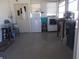 Utility room with a washing machine, freezer, storage, and an exterior door at 5233 Palena Blvd, North Port, FL 34287