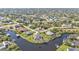 Beautiful aerial view of a waterfront neighborhood featuring canal homes and a variety of outdoor spaces at 9428 Bandera Ln, Port Charlotte, FL 33981