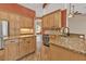Spacious kitchen features granite countertops, stainless steel appliances, and light wood cabinetry at 9428 Bandera Ln, Port Charlotte, FL 33981
