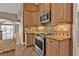 Well-equipped kitchen featuring granite countertops and stainless-steel appliances, great for cooking at 9428 Bandera Ln, Port Charlotte, FL 33981