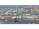 Stunning aerial view of waterfront homes along canals, many featuring private docks and swimming pools at 960 Messina Dr, Punta Gorda, FL 33950