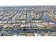 Stunning aerial view of waterfront homes along canals, many featuring private docks and swimming pools at 960 Messina Dr, Punta Gorda, FL 33950