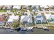 Aerial view of waterfront home with a private dock, screened lanai, and swimming pool at 960 Messina Dr, Punta Gorda, FL 33950