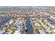 Scenic aerial view of waterfront homes situated along winding canals, many with boat access at 960 Messina Dr, Punta Gorda, FL 33950