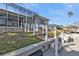 Manicured lawn with beautiful backyard leading to boat dock at 960 Messina Dr, Punta Gorda, FL 33950