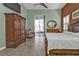Bedroom featuring an elaborate wooden bed frame, access to an outdoor area and a sizable wardrobe at 960 Messina Dr, Punta Gorda, FL 33950