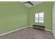 Bedroom with a ceiling fan, tile flooring, window and bench with storage underneath at 960 Messina Dr, Punta Gorda, FL 33950