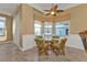 Cozy breakfast nook with a glass table, wicker chairs, and light filtering window shades at 960 Messina Dr, Punta Gorda, FL 33950