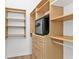 Organized walk-in closet featuring custom shelving, drawers, hanging rods and a built-in safe at 960 Messina Dr, Punta Gorda, FL 33950