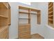 Organized walk-in closet featuring custom shelving, drawers, and hanging rods at 960 Messina Dr, Punta Gorda, FL 33950