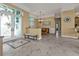Spacious entryway with tile flooring leading to the dining area, featuring decorative glass doors at 960 Messina Dr, Punta Gorda, FL 33950
