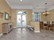 Spacious entryway featuring decorative glass doors, tile flooring, and tan walls with white trim at 960 Messina Dr, Punta Gorda, FL 33950