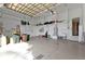Large and tidy garage featuring epoxy flooring, storage shelves, and efficient organization at 960 Messina Dr, Punta Gorda, FL 33950