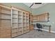 Home office with built-in shelves and cabinets, providing ample storage and workspace at 960 Messina Dr, Punta Gorda, FL 33950