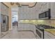 A modern kitchen with stainless steel appliances and wooden cabinets at 960 Messina Dr, Punta Gorda, FL 33950