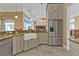 A well-lit kitchen with stainless steel appliances and a farmhouse sink at 960 Messina Dr, Punta Gorda, FL 33950