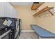 Functional laundry room featuring modern appliances, counter space, and practical storage solutions at 960 Messina Dr, Punta Gorda, FL 33950