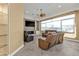 A cozy living room featuring leather furniture and a decorative fireplace wall at 960 Messina Dr, Punta Gorda, FL 33950